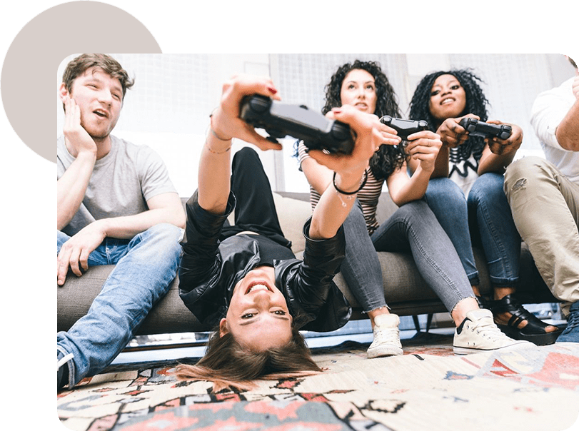 A group of people sitting on the floor playing video games